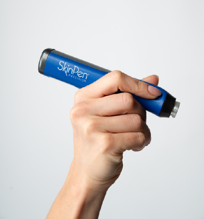 Hand holding a SkinPen device