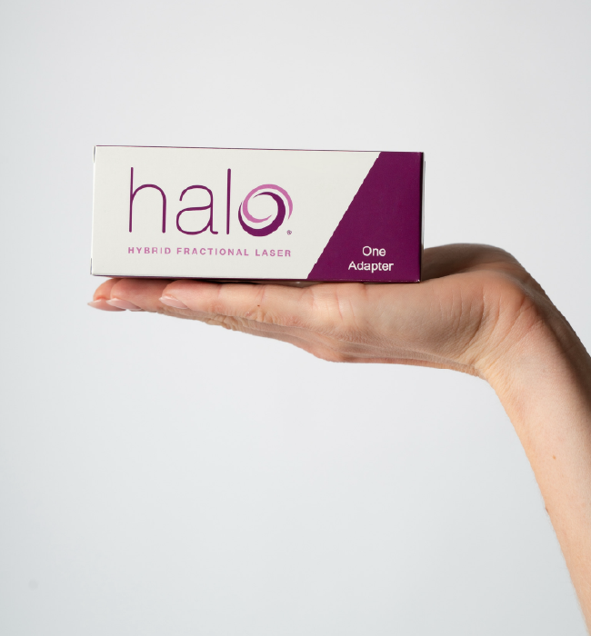 Hand holding Halo laser adapter box